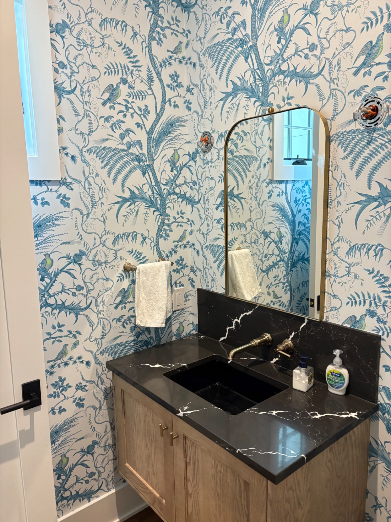 Dark botanical powder room