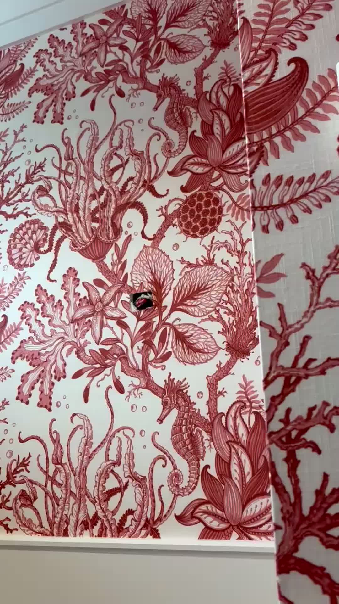 Full-wall view of the coral-red seahorse, octopus and coral pattern with hand-drawn linework